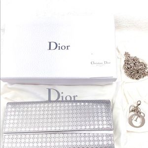 Christian Diors.  WOC in silver with silver hardware.